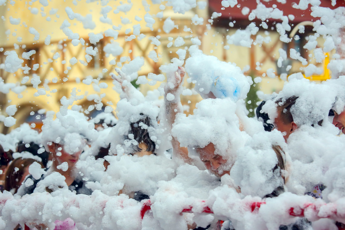People dancing at the foam party
